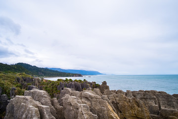 Fototapeta na wymiar Pancake rocks, West coast, New Zealand. Cloudy day.