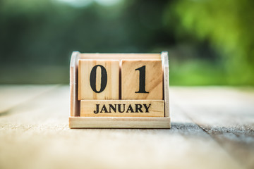 Wood brick block show date and month calendar of 1st January or New year day.