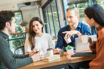 Young businessman and woman meeting and share idea to colleague