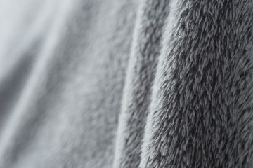 gray fluffy textile background selective focus