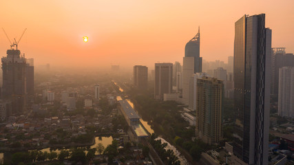 Fototapeta na wymiar Beautiful sunrise with skyscrapers in Jakarta