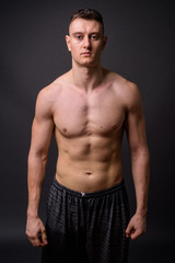Fototapeta premium Portrait of young handsome muscular fitness man shirtless