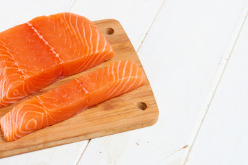red fish on a wooden white table