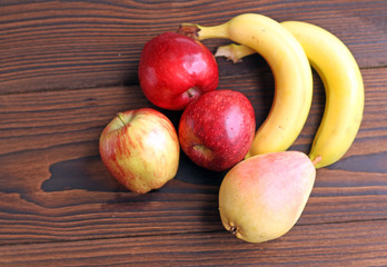 Fototapeta na wymiar Fruits. Apples, pear and banana.