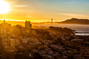 Sunset in San Francisco with a view on the city and the Golden Gate bridge