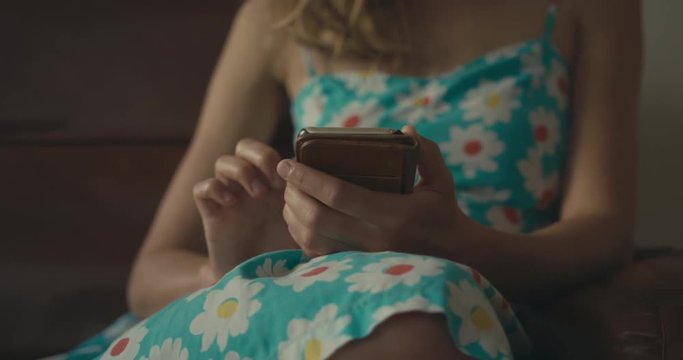 Young woman using smartphone at home