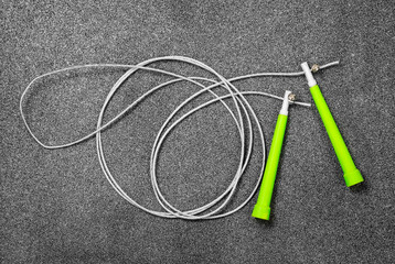 Jump rope for fitness on a gray background