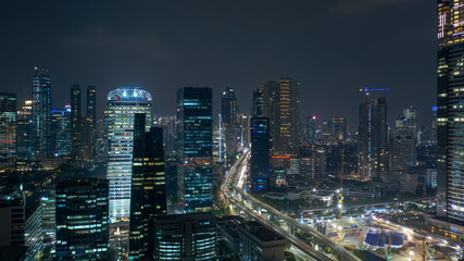 Naklejka na ściany i meble Nighttime in Jakarta city with skyscraper view