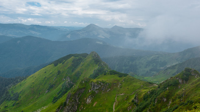 Scenic view of Carpathian mountains hills on sunny day © Denys Kurbatov