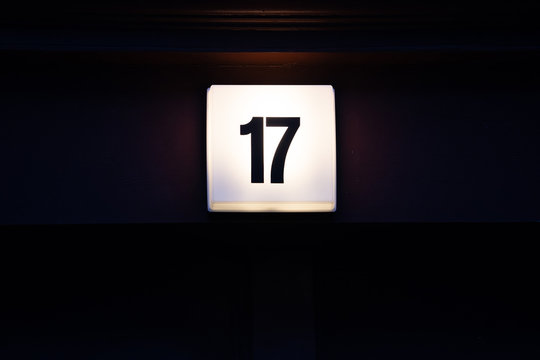 House Number with Digit 17 on a Lamp