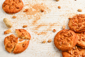Peanut cookies on wooden table with sugar.