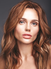 Naklejka premium Beauty fashion portrait of young blond woman model with natural makeup and perfect skin posing in studio