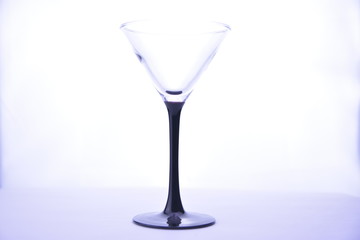 crystal transparent martini glass on a white background