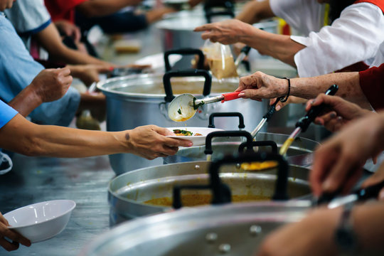 Sharing of food from volunteer hands to homeless people : The concept of feeding