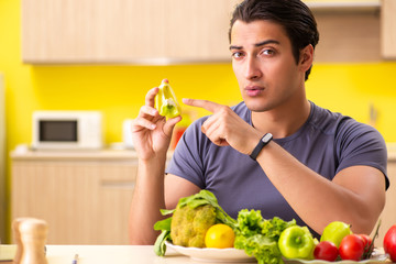 Young man in dieting and healthy eating concept