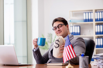 Businessman with American flag in office