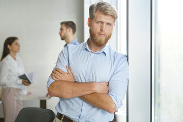 Fototapeta premium Portrait of a happy young casual businessman at office.