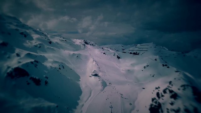Scenic winter aerial flight of drone over the mountains and ski resort. Beautiful panorama, sunny day on ski resort. Kaltenbach, Zillertal,  Austria. 4K.