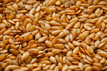 Fototapeta premium Background texture of white flax seeds. Useful cereals.
