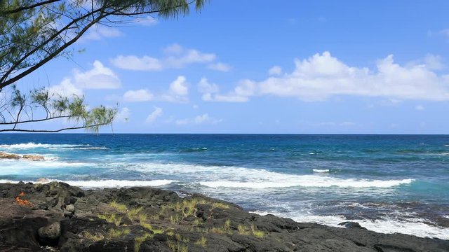 Scenic Hilo Hawaii rocky beach coast and surf. Big Island, largest, most volcanic active location. Economy is tourism based. Water and tropical beach recreation and fun. Beautiful.