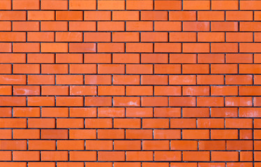 Wall from a red brick as a background