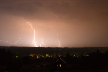 Fototapeta na wymiar lightning over coutryside