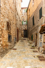 Fototapeta na wymiar Colorful narrow streets in the medieval town of Campiglia Marittima in Tuscany - 10