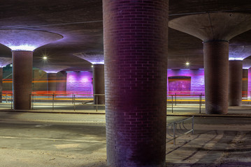 A violet illuminated underpass below an highway bridge in Copenhagen in Denmark - 2