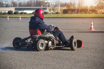 Go-kart competitions, go-kart driver drives a kart, close-up, rushes to the finish, winner