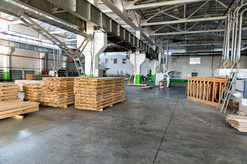 Shop woodworking plant. Worker sawmill