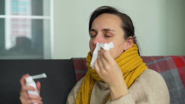 Sick Young Woman Using Throat Spray