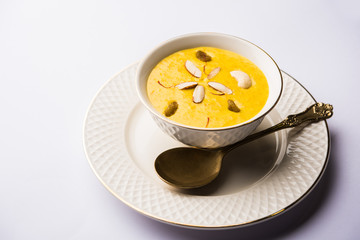 Kaddu or Pumpkin Kheer Or Bhoplyachi Kheer in Marathi and gummadikaya payasam in Telugu, Garnished with dry fruits. served in a bowl over moody background. Selective focus
