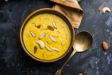 Kaddu or Pumpkin Kheer Or Bhoplyachi Kheer in Marathi and gummadikaya payasam in Telugu, Garnished with dry fruits. served in a bowl over moody background. Selective focus