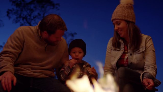 Cute Family Enjoy Roasting Marshmallows, They Laugh, Little Boy Eats Chocolate, Slow Motion