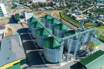 The modern granary. Metal silos with green roofs. © nordroden