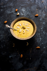 Kaddu or Pumpkin Kheer Or Bhoplyachi Kheer in Marathi and gummadikaya payasam in Telugu, Garnished with dry fruits. served in a bowl over moody background. Selective focus