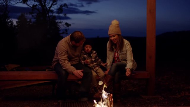 Happy Family Roast Marshmallows, Dad Shows His Son How To Warm His Hands By Fire, Slow Motion
