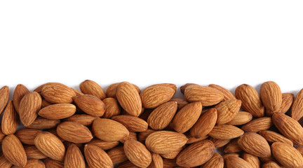 heap of almonds isolated on white background