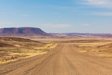 Endless roads in a breathtaking landscape, Skeleton Coast Park, Namibia.