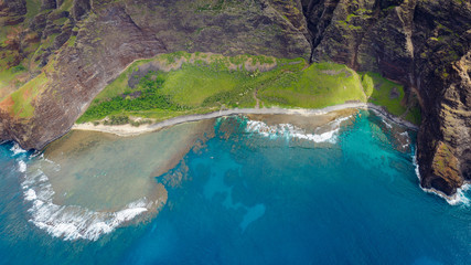 Kaahole Valley at the monumental Na Pali Coast, aerial shot from a helicopter, Kauai, Hawaii.