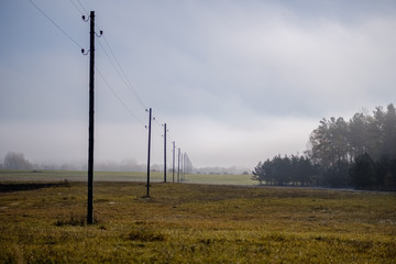 Fototapeta na wymiar power line electricity poles in country