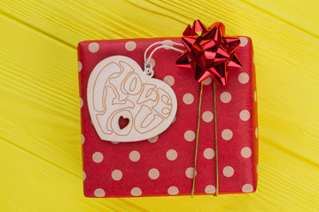 Ged dotted gift box and heart shaped wood. Decorative handmade wood with I love you heart. Yellow...