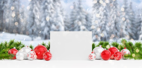 Blank Christmas card laying on red baubles and gift 3D rendering