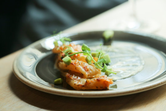 Langoustine, or shrimp appetizer with avocado