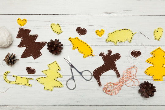 Handmade yellow Christmas craft composition. Kids creative decorations.