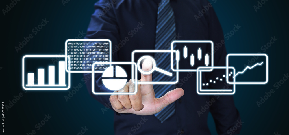 Aufkleber Businessman and big data analytics and business intelligence concept with chart and graph icons on a digital screen interface