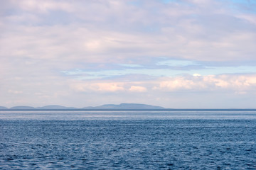 Summer afternoon view from the sea to the islands of the Body (Kuzova archipelago) in the White Sea