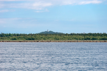 Unique Lighthouse church in Holy Ascension monastery of the Solovki monastery. View from White Sea, Russia