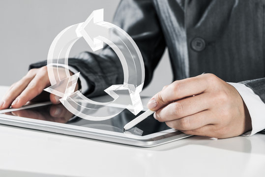 Female hands using graphics tablet and glass icons fly in air. M