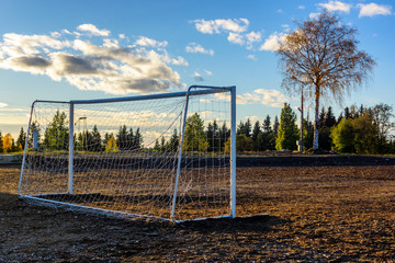 Old football goals on football field in autumn